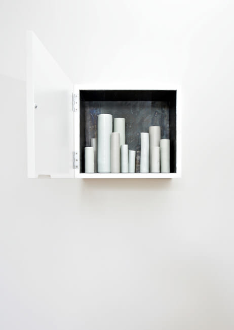 South South West 2007 Lead-lined white laquered cabinet, porcelain vessels in various glazes